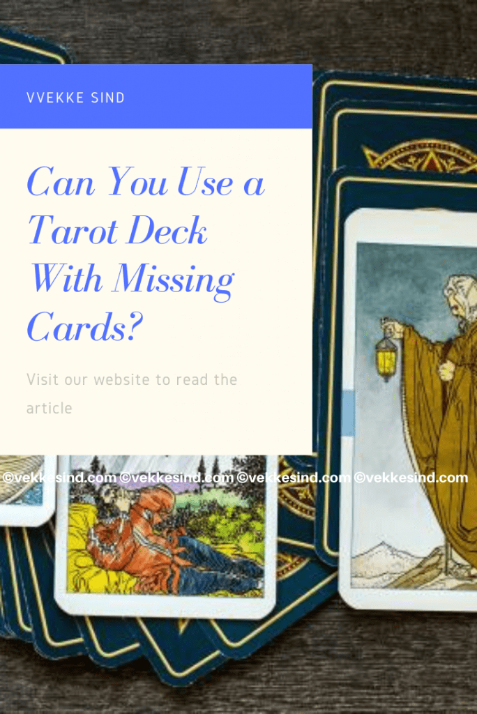 A tarot deck spread out on a table, with one position empty to suggest a missing card