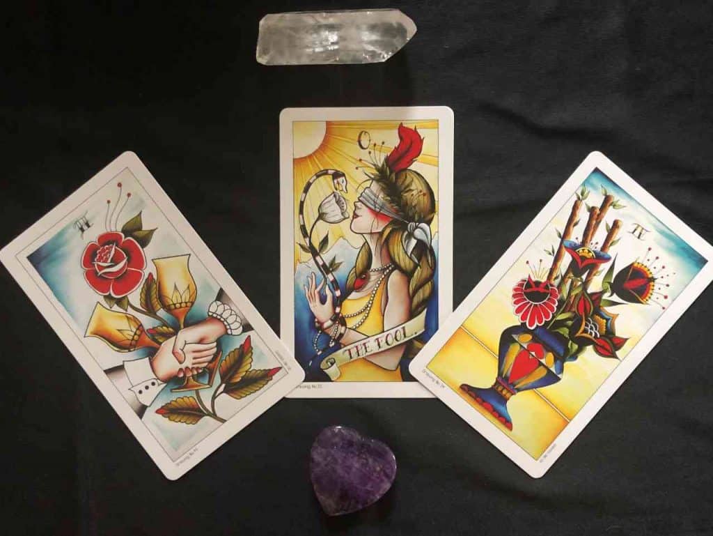 Eight of Coins Tattoo Tarot deck displayed for a reading