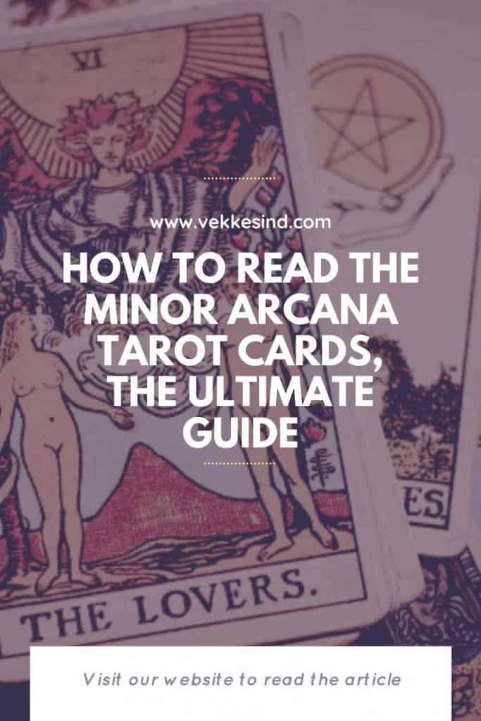 A person laying out Minor Arcana court cards for a tarot reading, pip numbers and suit symbols visible on the spread