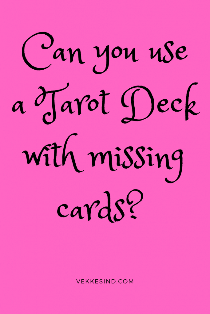 A close-up of tarot cards being handled and examined during a reading session