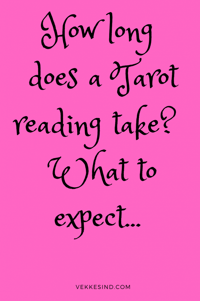 Tarot cards laid out in a spread on a table during a professional reading session