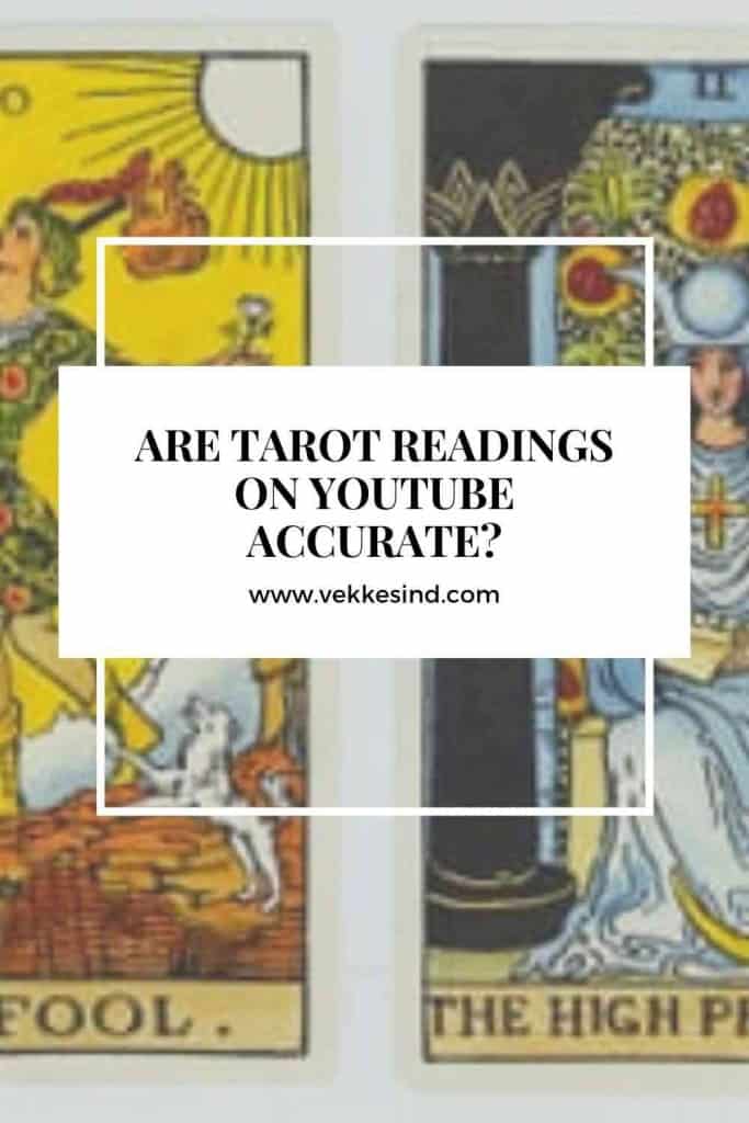 A person thoughtfully watching a tarot reading video, taking notes and reflecting