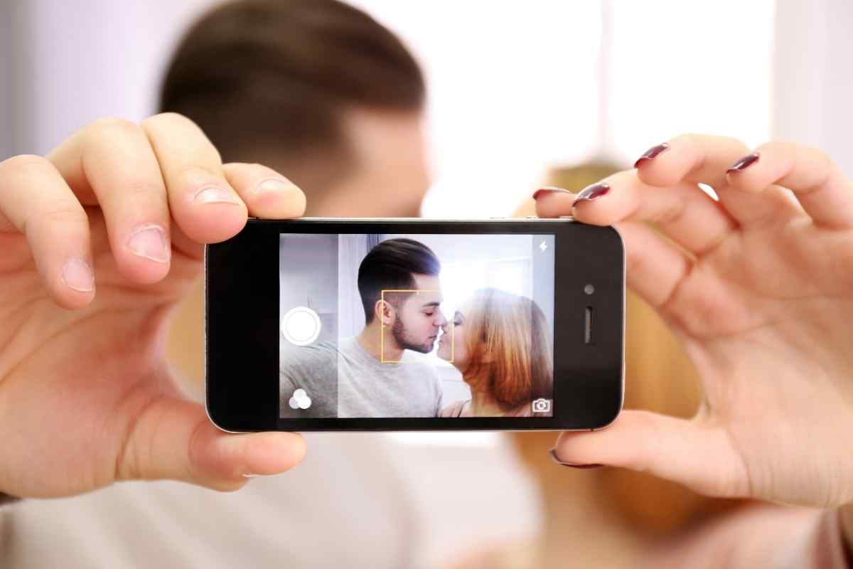 Couple having a warm, easy conversation over coffee, relaxed and genuinely comfortable together
