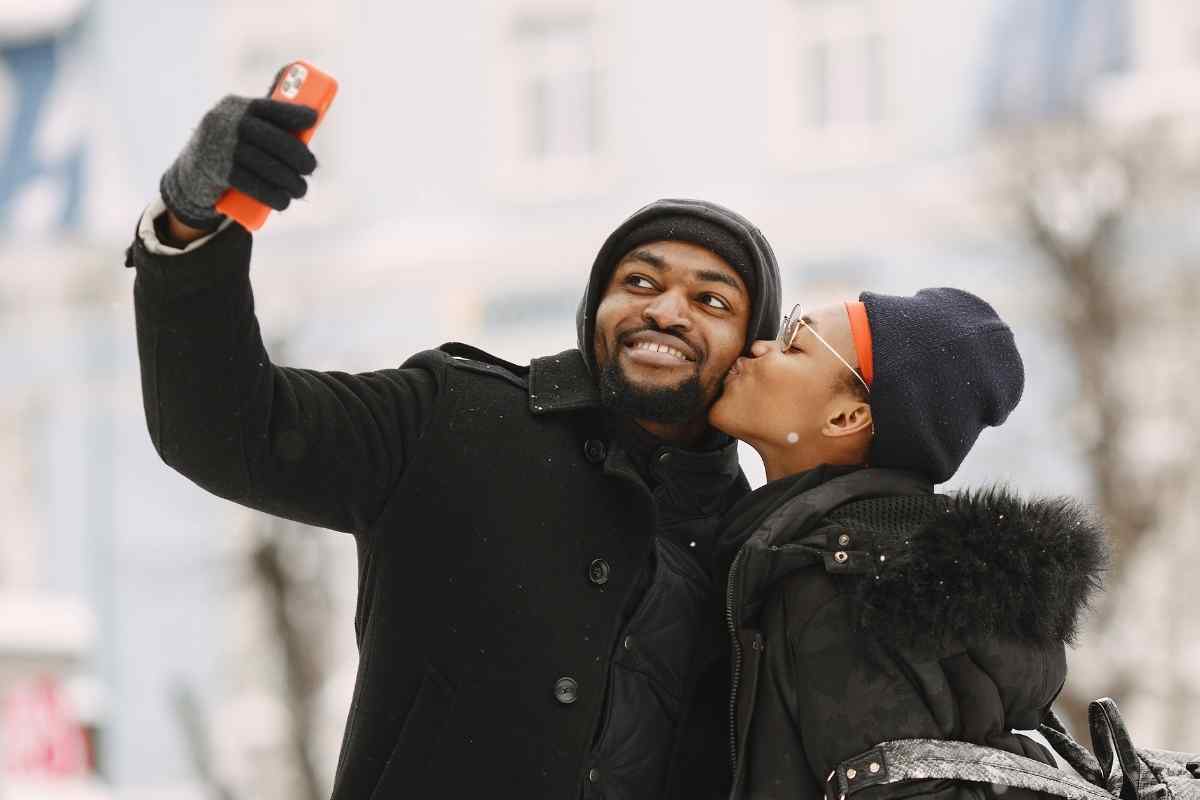 Man texting with calm, confident composure and a naturally warm expression