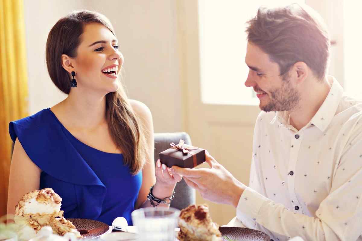 Couple sitting together comfortably, both relaxed and at ease