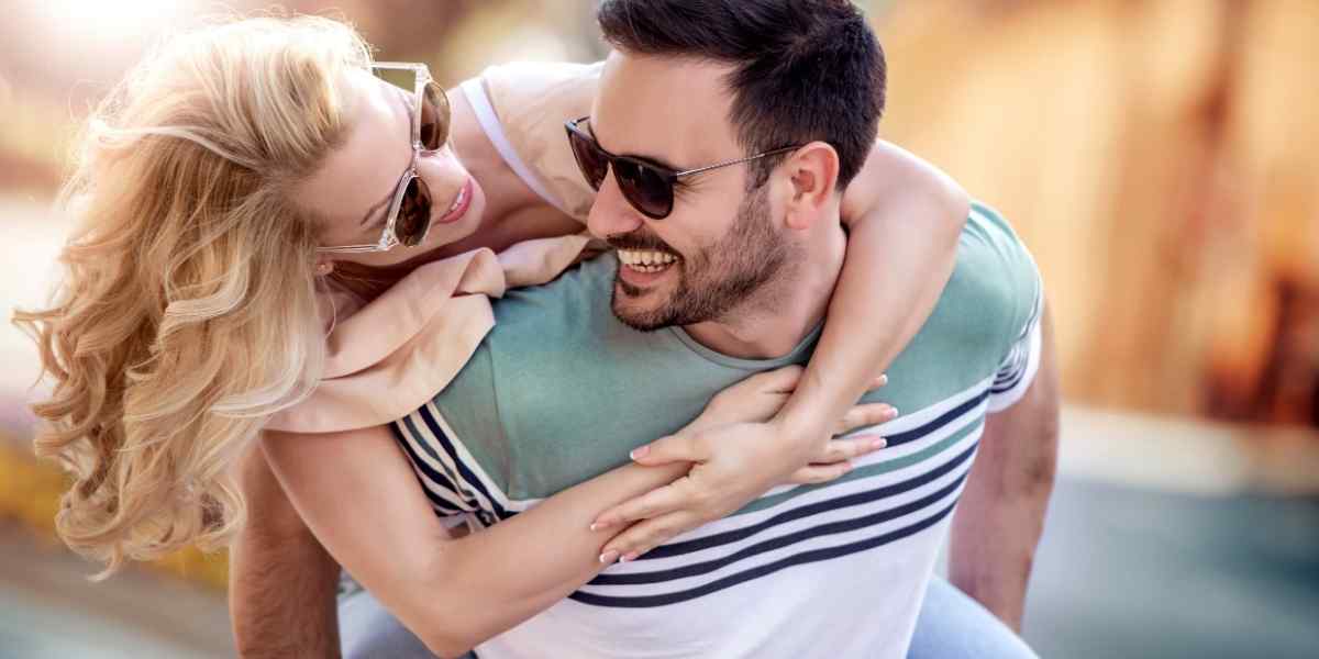 A couple sitting together in a moment of quiet intimacy, the emotional safety a Cancer woman looks for in a partner
