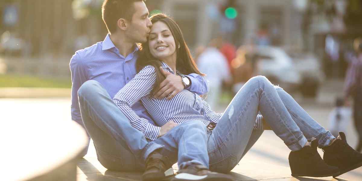 A Capricorn woman and man engaged in serious, purposeful conversation, reflecting her attraction to ambition and direction