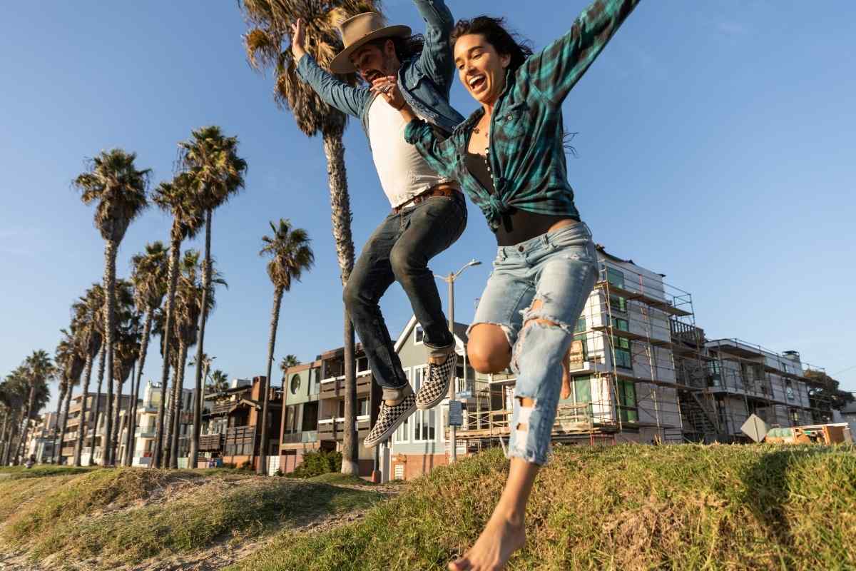 A woman moving forward with purpose alongside a confident man
