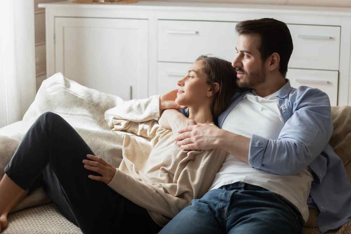A Cancer woman and a man in close, warm conversation, relaxed and comfortable together