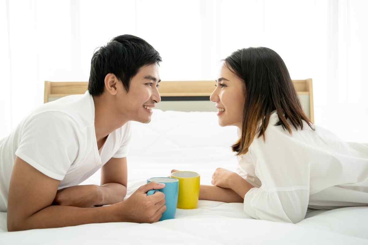 Two partners caught in a spontaneous, playful intimate moment