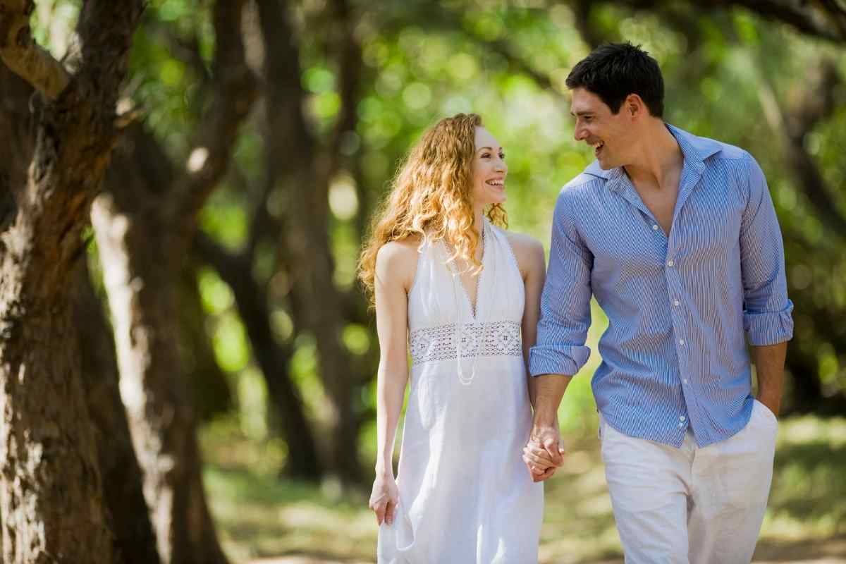 Two people standing at a crossroads with quiet thoughtfulness, each steady on their own ground