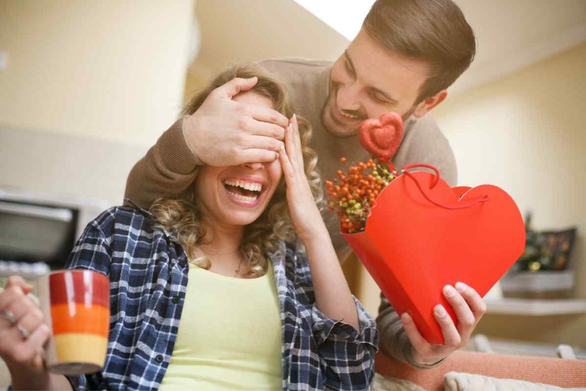 A man sitting apart from his partner with closed-off body language, representing the emotional withdrawal of a Taurus man who has decided to move on