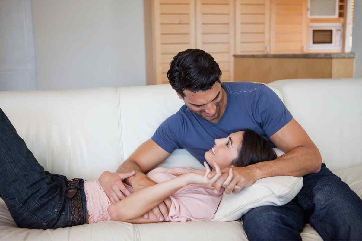 Two people at ease together, sharing a warm and physically present moment of connection