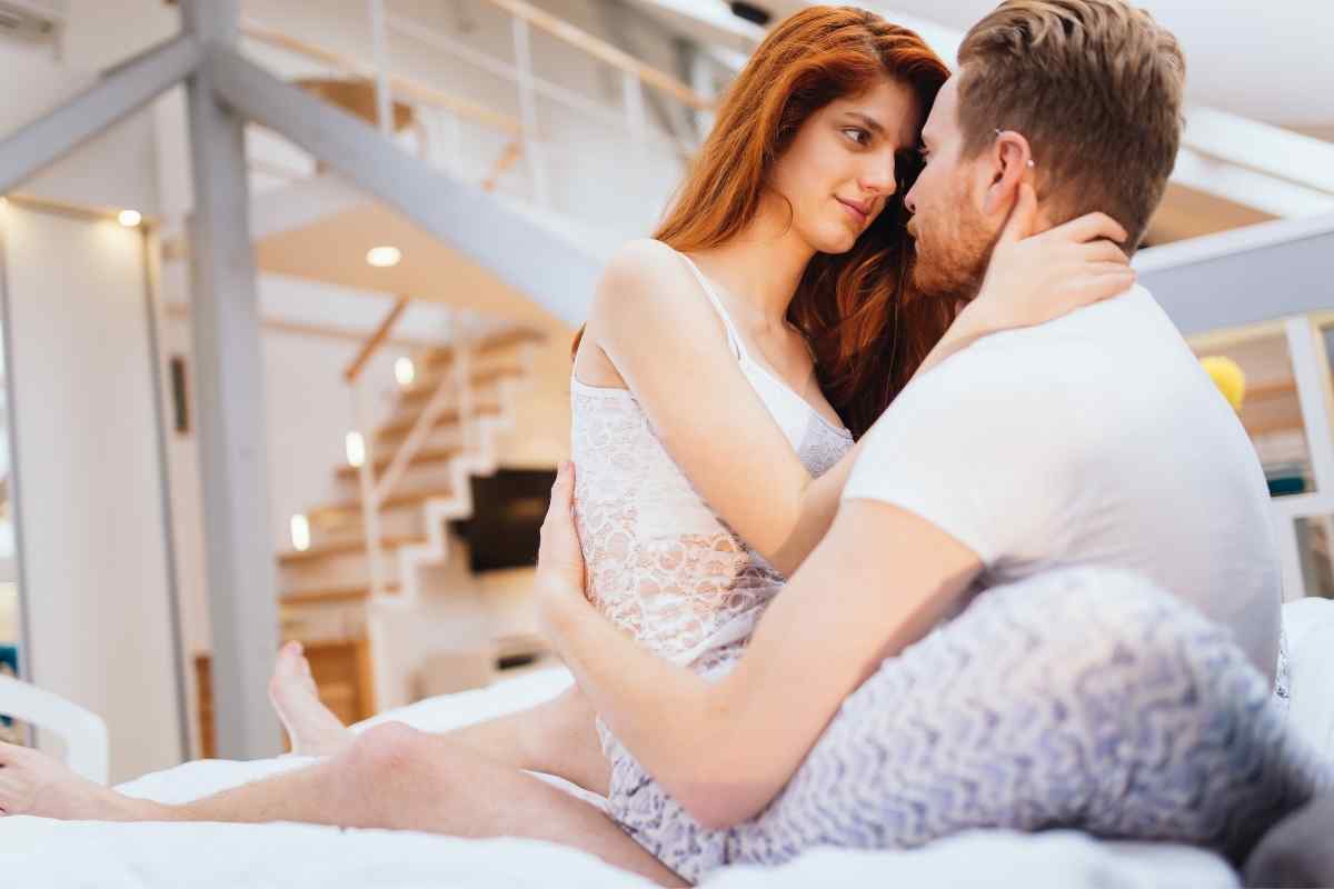 A couple sharing a romantic candlelit evening together, relaxed and connected