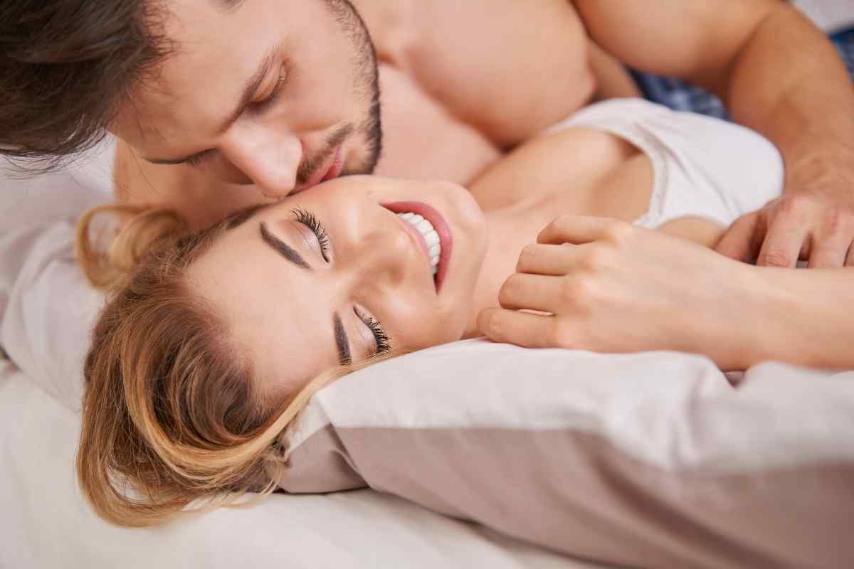 A couple sharing a warm, energetic moment together