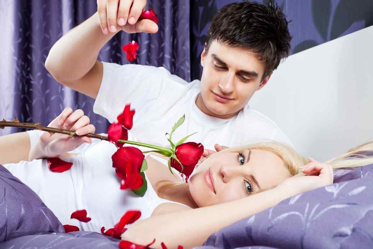 A woman and man in a close, intimate conversation