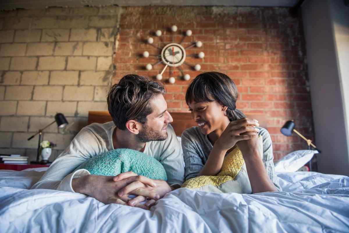 A man and woman in an unhurried, genuinely connected intimate moment