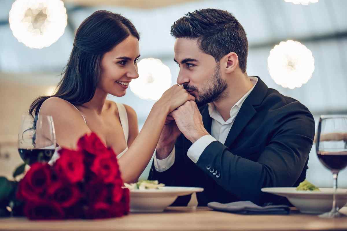 A woman and man in a quiet, confident moment together, the exchange grounded and sincere, illustrating the kind of direct and purposeful intimacy that reaches a Capricorn man