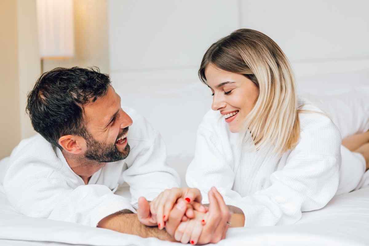 A confident woman engaging an energetic man in playful conversation
