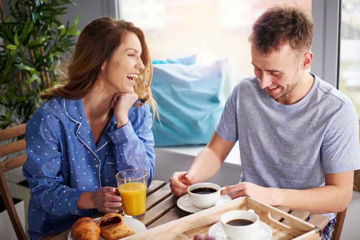 Capricorn man and woman sharing a composed, engaged moment at a quiet table together