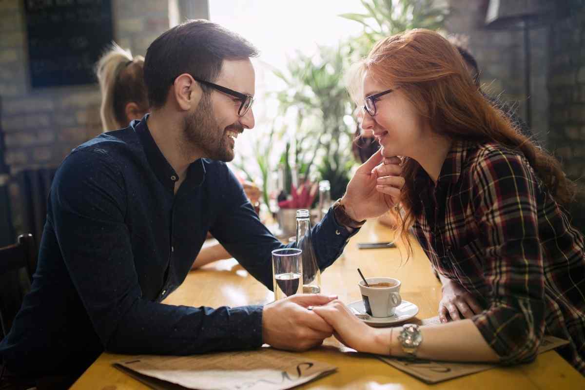 A couple engaged in genuine conversation, at ease with each other without either performing for the other