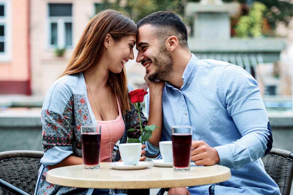 A couple sitting apart, each looking in different directions, showing emotional distance