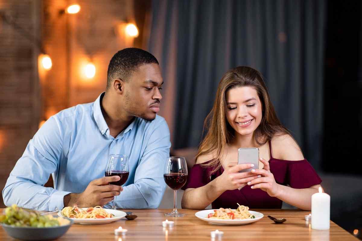 Aries man sitting with a serious, tense expression, clearly preoccupied