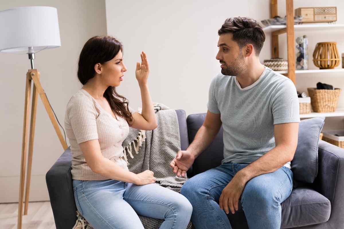 Two people talking honestly and without defensiveness at a quiet table