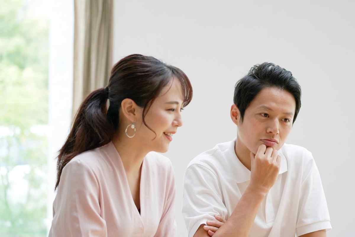 A couple sitting across from each other in a quiet space, ready to have an honest conversation