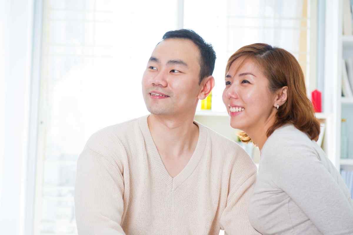 Two people at a table in a calm, focused conversation, both present and listening carefully