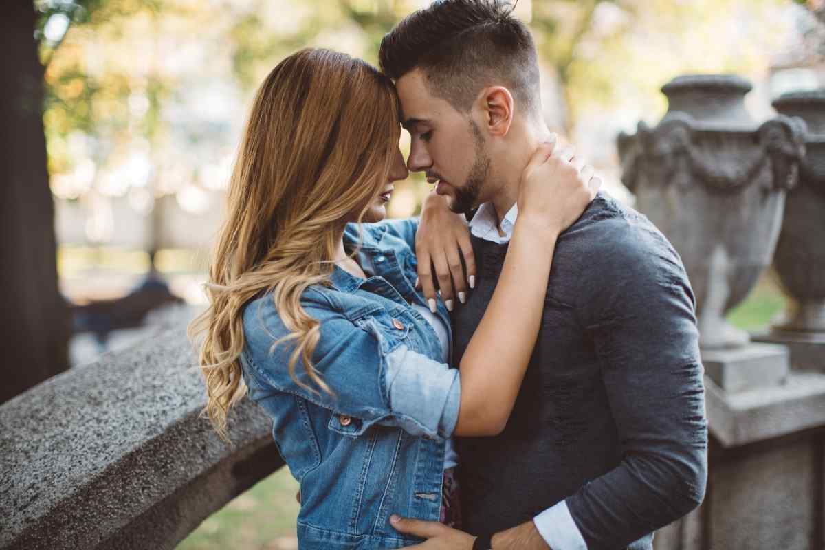 Two partners seated close together in comfortable quiet, representing the deep ease that a Scorpio woman and Cancer man can build when both feel genuinely safe