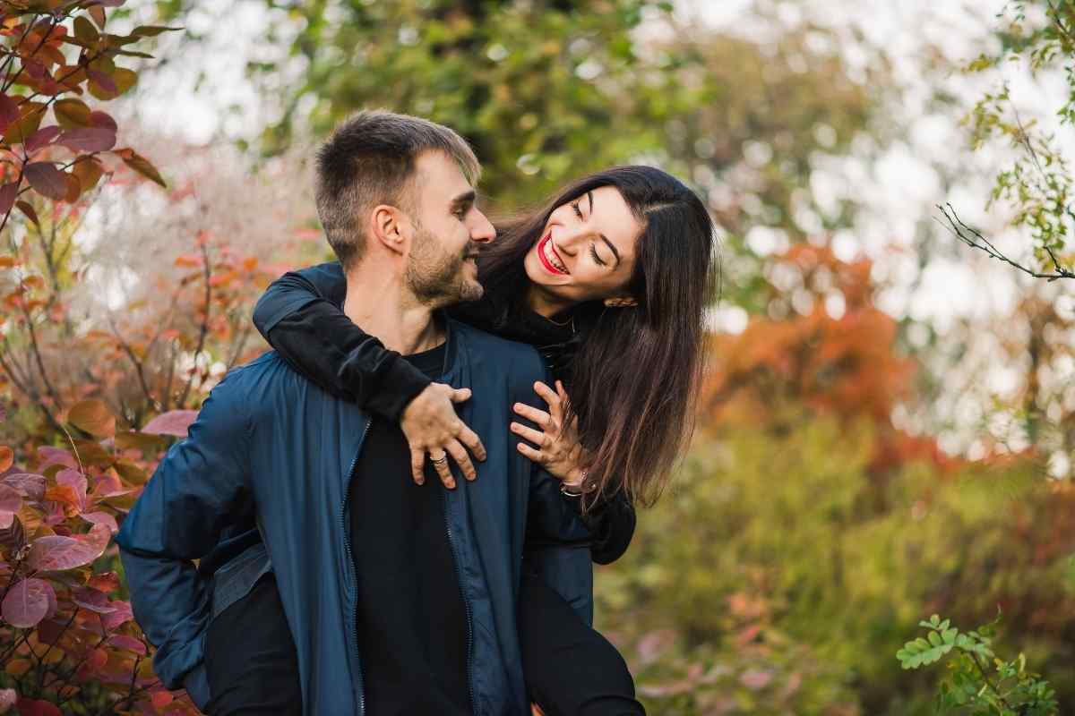 Two partners sitting apart but looking toward each other, representing the emotional pull of a long-distance relationship