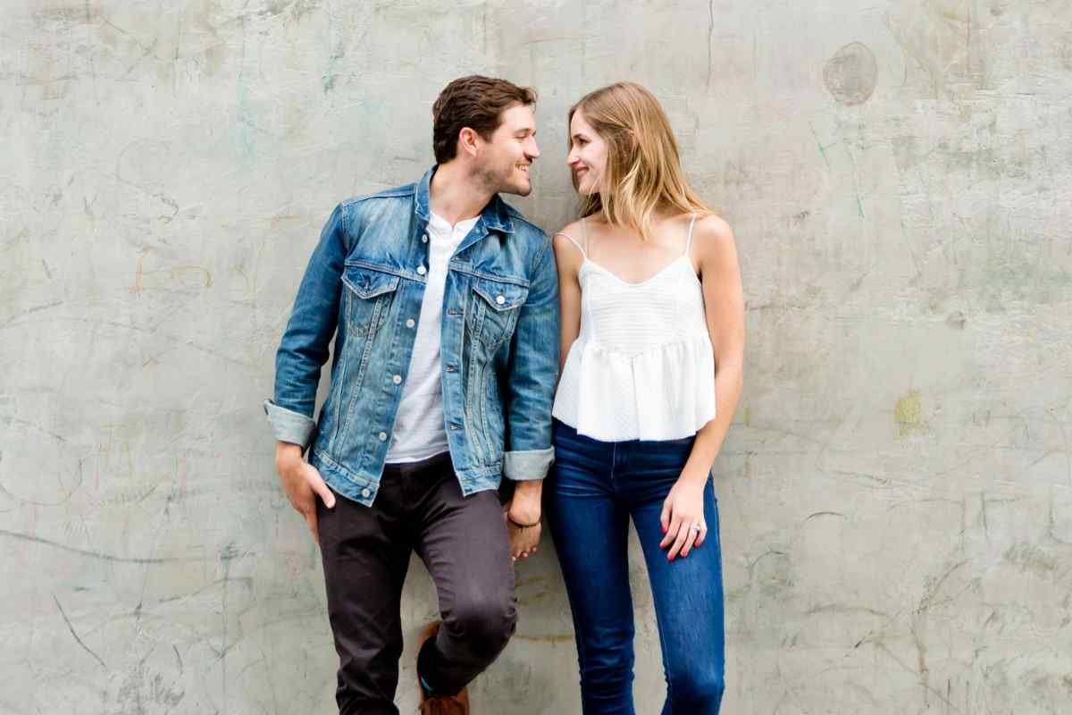 Couple reuniting at an airport, embracing warmly after time apart