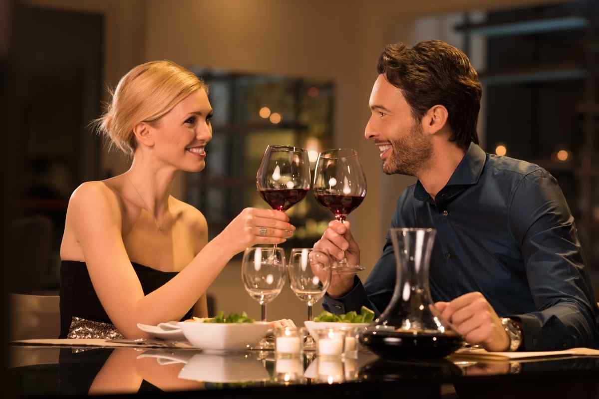 A man and woman in easy, unhurried conversation, both paying genuine attention to each other
