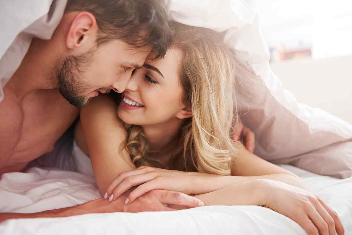 A woman at a lively social gathering, engaged and fully present in conversation