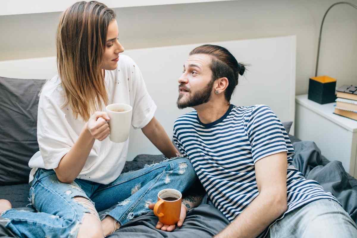 A couple in a tender, intimate moment where the man is fully present and attentive