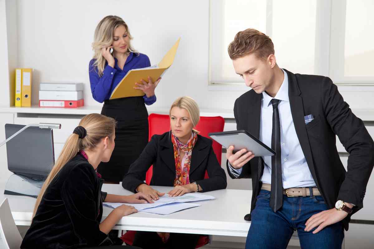 Leo Moon executive confidently addressing a team in a professional setting