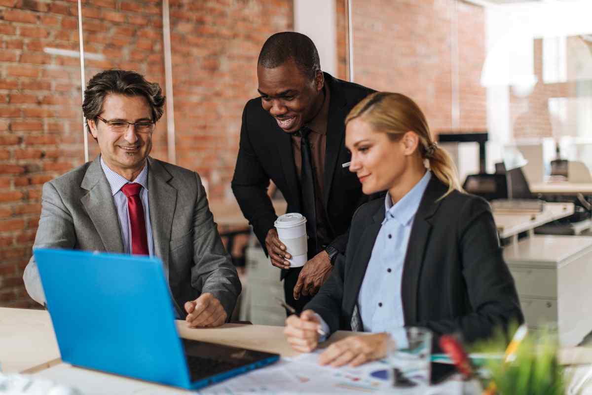 Virgo Moon analyst focused on detailed data work at a computer, surrounded by organized notes