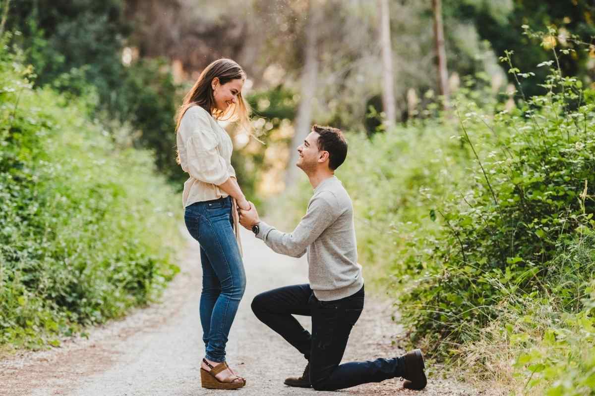 A couple walking together in a park, talking calmly and at ease with each other in relaxed strides