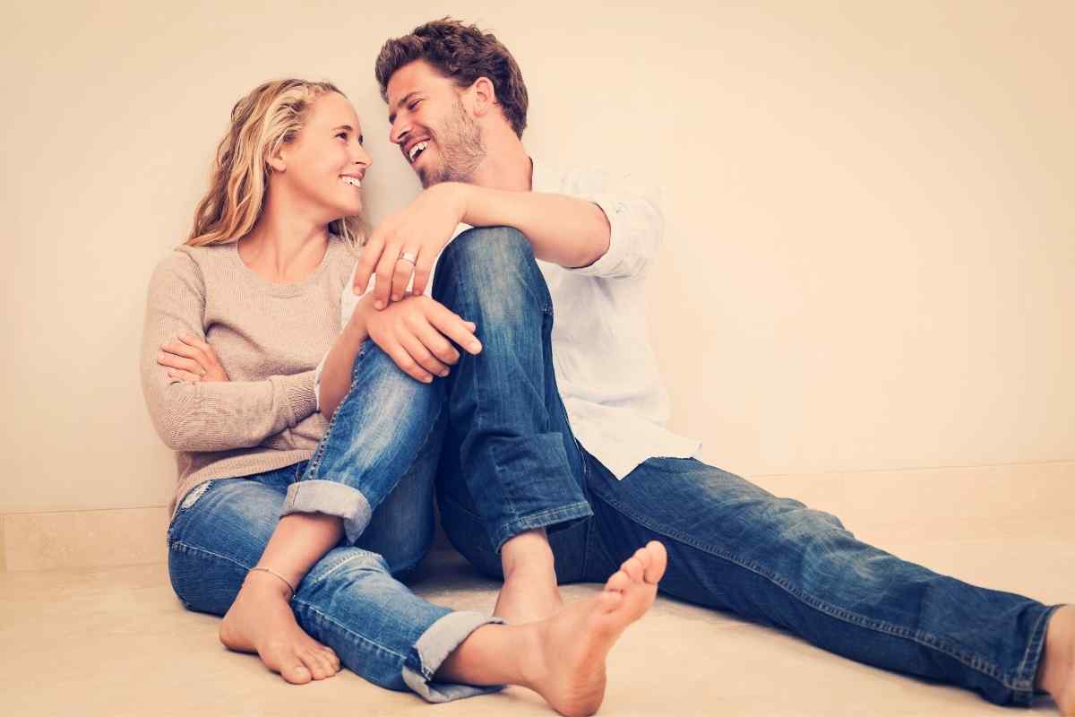 A couple in conversation, engaged with each other's ideas in a relaxed setting