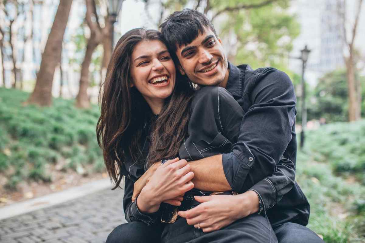 A couple in a tense conversation, with visible discomfort and one partner looking away