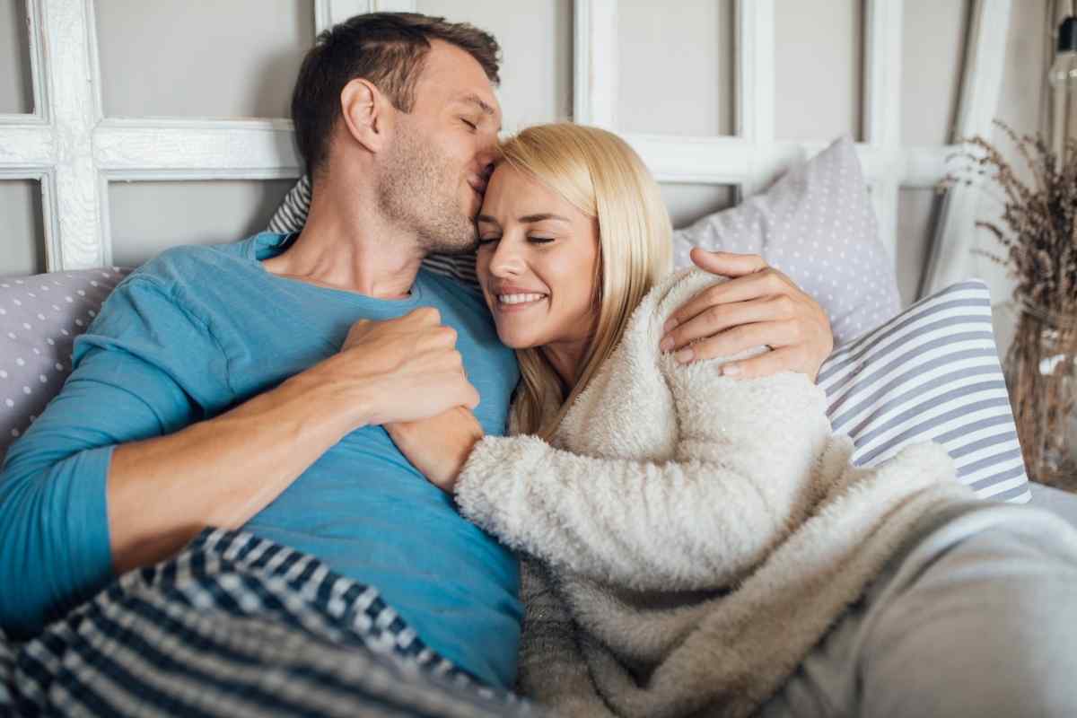A couple using a gentle kiss to bridge an emotional moment between them