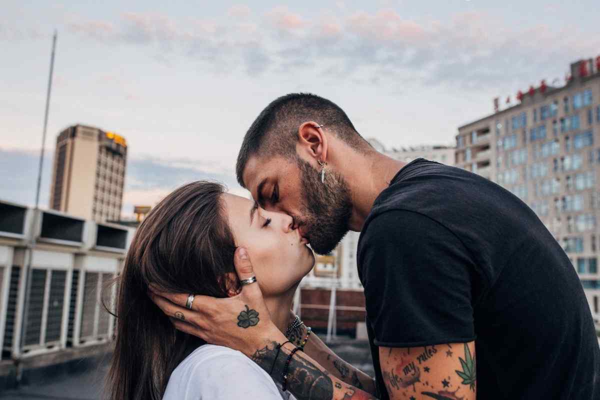 A couple in a genuinely warm and present moment, the energy between them unhurried and mutual