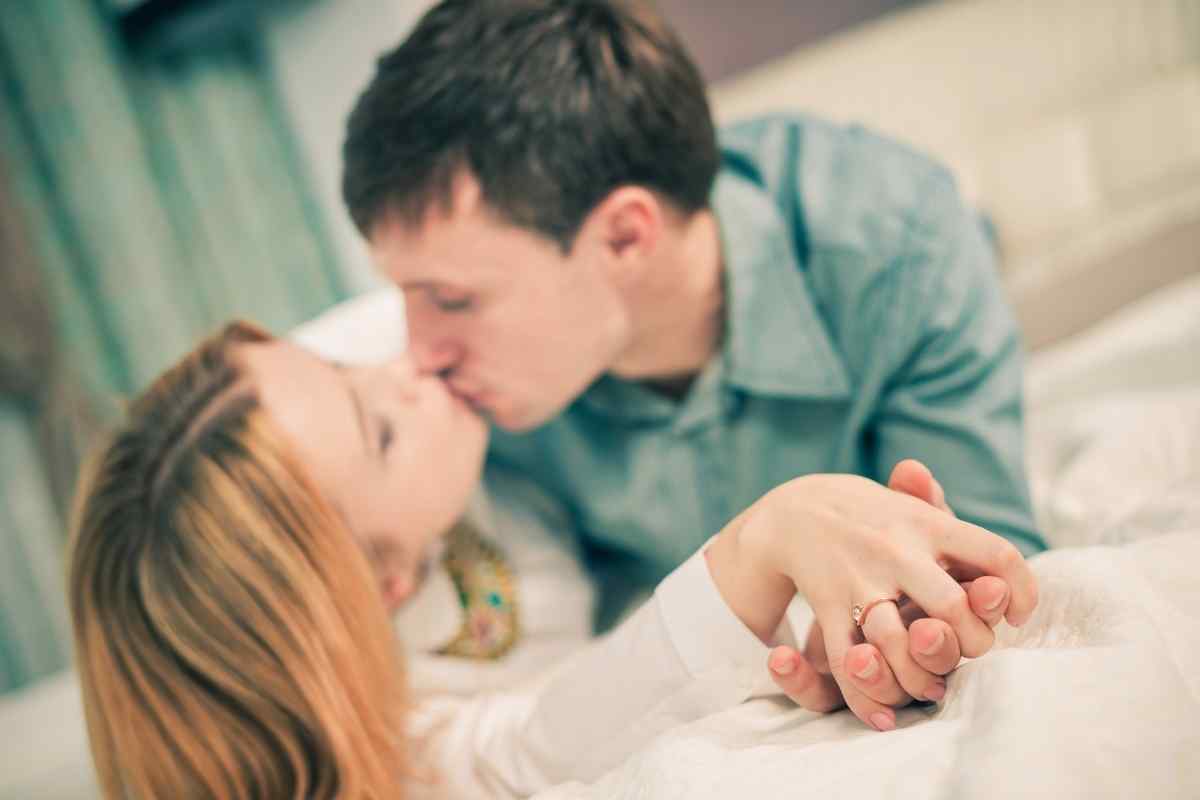 A couple leaning close together in a quiet, intimate moment