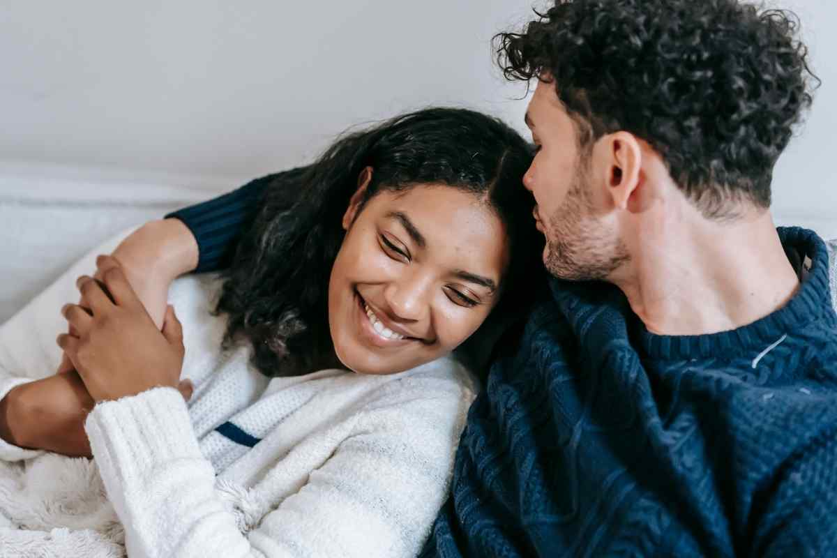 A woman at ease in a warm, intimate moment with her partner