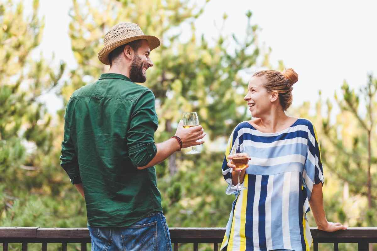 A man and woman in close, attentive conversation, clearly focused on each other