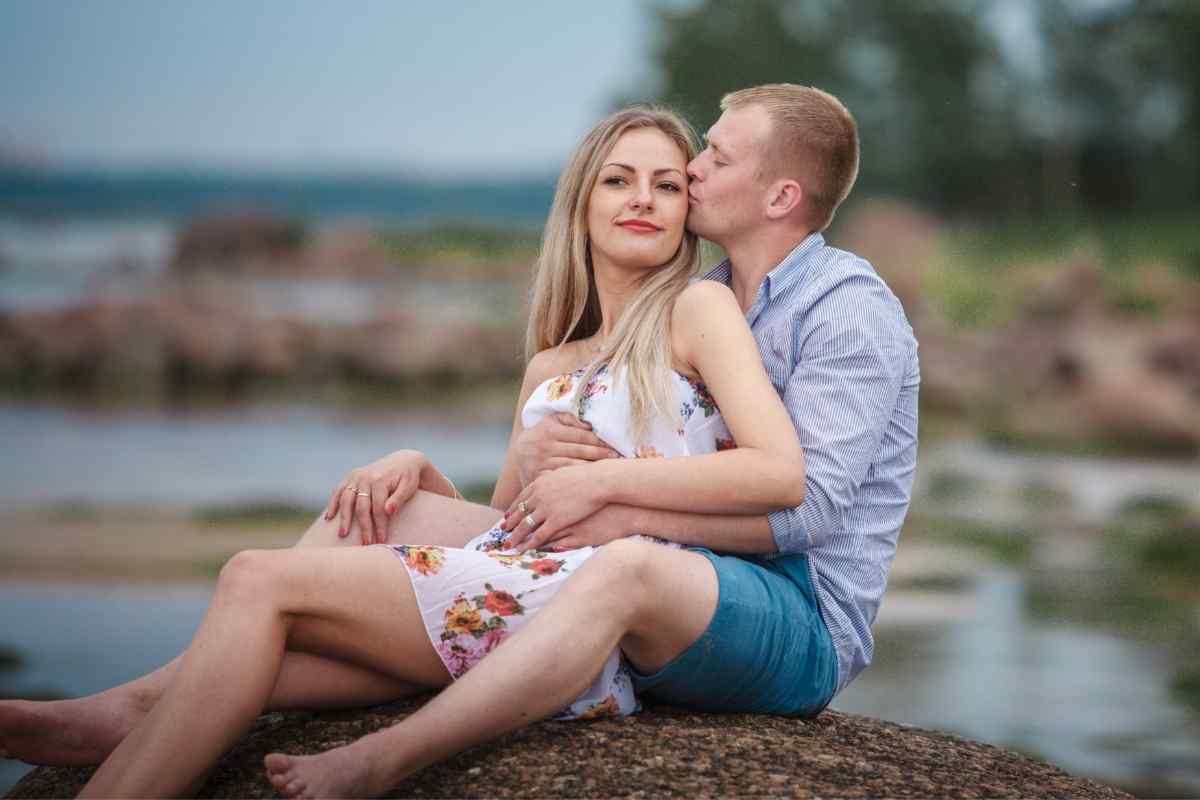 A couple relaxed and connected in a warm, comfortable setting