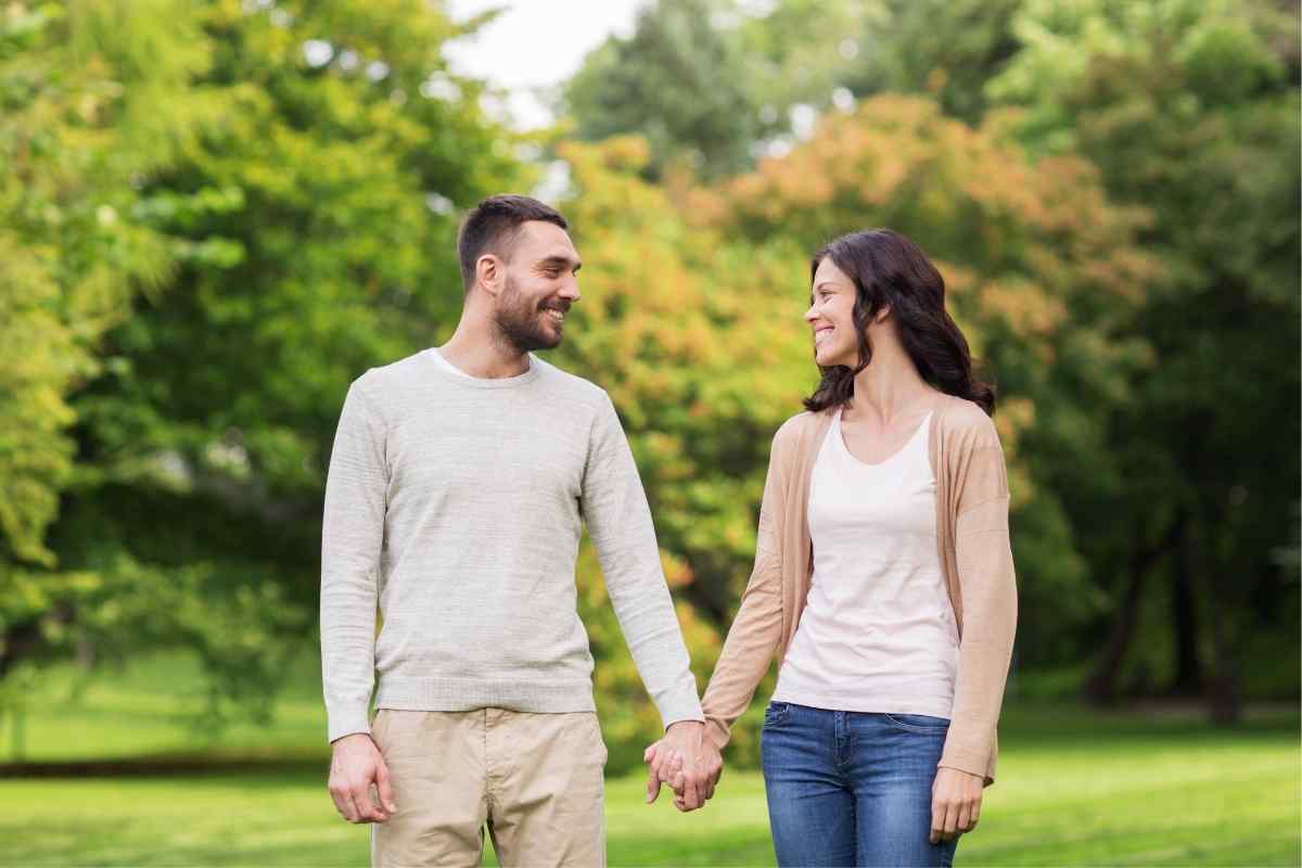 A man and woman walking beside each other comfortably after a pleasant first date