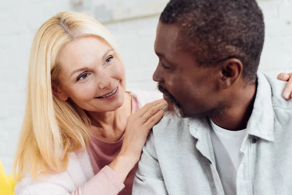 Two people with matching energy and confidence engaged in a lively interaction, representing the dynamic compatibility of Aries Sun and Aries Moon