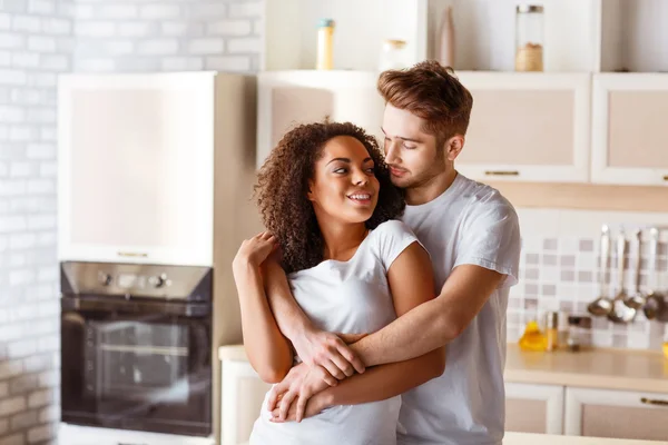A couple sharing a warm and grounding moment of genuine emotional connection, reflecting the potential for depth when Aries Sun meets Cancer Moon